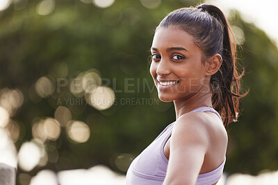 Buy stock photo Portrait of a sporty young woman exercising outdoors