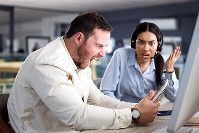 Buy stock photo Shot of a young businessman screaming and holding a digital tablet while his colleague watches in shock
