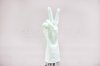 Buy stock photo Shot of an unrecognizable person showing a peace sign against a white background