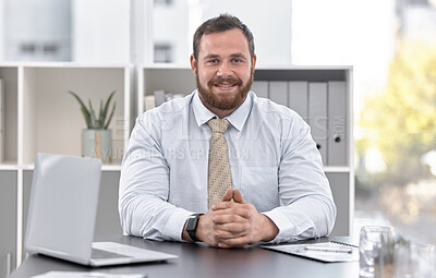 Buy stock photo Portrait of a confident young businessman working in an office
