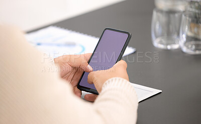 Buy stock photo Closeup shot of an unrecognisable businessman using a cellphone with a blank screen in an office