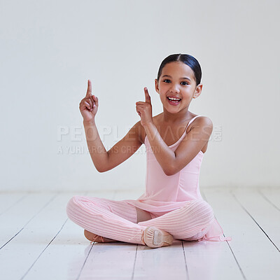 Buy stock photo Portrait of a little girl pointing in a ballet studio