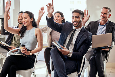 Buy stock photo Shot of a group of businesspeople raising their hands in a meeting at work
