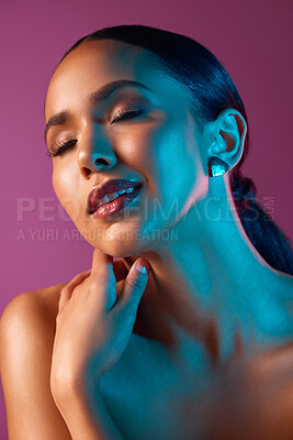 Buy stock photo Cropped shot of an attractive young woman posing in studio against a pink background