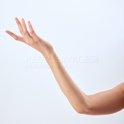 Buy stock photo Studio shot of an unrecognizable woman’s beautiful hand against a grey background