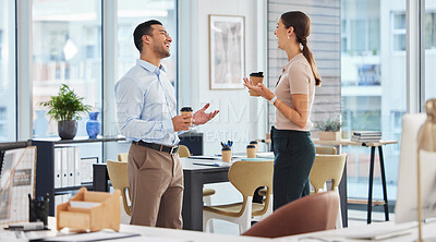 Buy stock photo Shot of two business colleagues talking while enjoying coffee