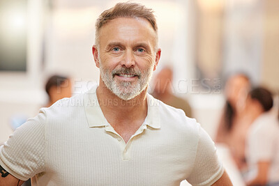 Buy stock photo Portrait of a handsome mature man posing with his colleagues having a meeting in the background