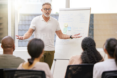 Buy stock photo Shot of a handsome mature businessman giving a presentation in the conference room