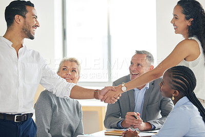 Buy stock photo Shot of a young businesswoman welcoming a new team member aboard