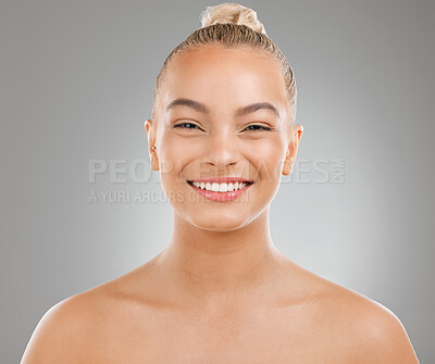 Buy stock photo Shot of an attractive young woman posing against a studio background