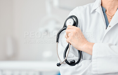 Buy stock photo Shot of a dentist holding her stethoscope