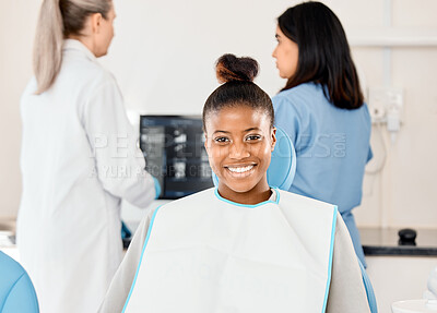 Buy stock photo Shot of a young woman awaiting treatment in her dentists office