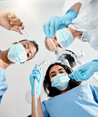 Buy stock photo Shot of a team of dental staff preparing for a procedure