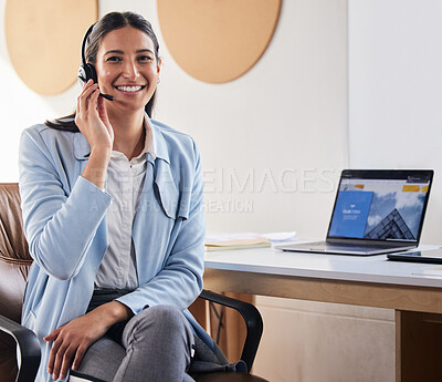 Buy stock photo Shot of a woman wearing a headset while sitting at her desk