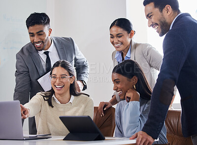 Buy stock photo Shot of a group of colleagues laughing together