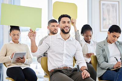 Buy stock photo Cropped shot of a group of young and diverse group of businesspeople holding speech bubble-shaped placards during a seminar in the conference room