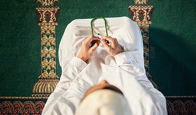 Buy stock photo Shot of a unrecognizable muslim male praying in a mosque