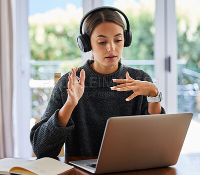 Buy stock photo Cropped shot of an attractive young female entrepreneur working on her laptop at home