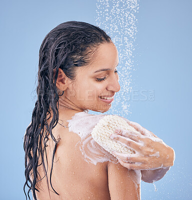 Buy stock photo Shot of a young woman using a sponge while taking a shower