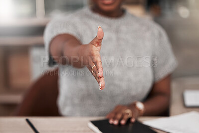 Buy stock photo Shot of an unrecognisable businesswoman extending her arm for a handshake in a modern office