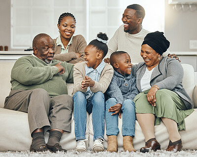 Buy stock photo Shot of a family bonding on a sofa at home