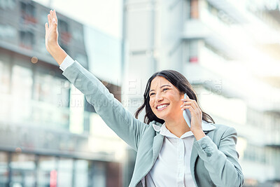 Buy stock photo Shot of a young businesswoman using a smartphone and gesturing to order a cab against an urban background