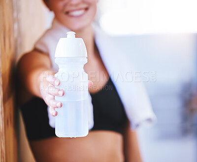 Buy stock photo Closeup shot of an unrecognisable woman holding a water bottle while exercising in a gym