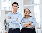 Portrait of call center colleagues. Businesspeople working in customer service wearing headsets, arms crossed.Smiling sales reps. IT service agents at work in the office. Two diverse coworkers