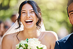 Close up of a happy beautiful bride laughing and having fun on her wedding day. Face of joyful bride enjoying her dream wedding