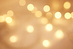 Abstract blurry twinkled lights background with bokeh defocused yellow lights. Closeup blurred glittery sparkly lights. Closeup blurry candle lights at an evening celebration