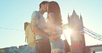 A young couple in love kissing on vacation in London