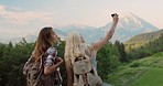 Women travelling taking selfies. Two women taking selfies on vacation